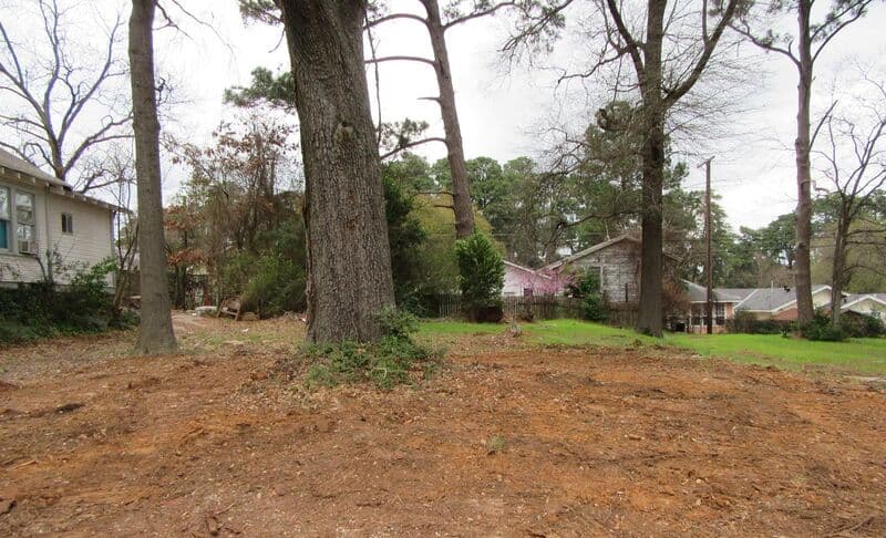 The same lot after the foundation and brick were removed and the ground was graded