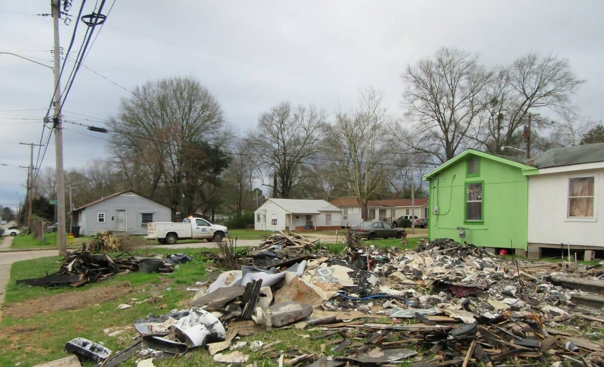 Debris pile from a demolished house on a residential lot, waiting to be loaded out