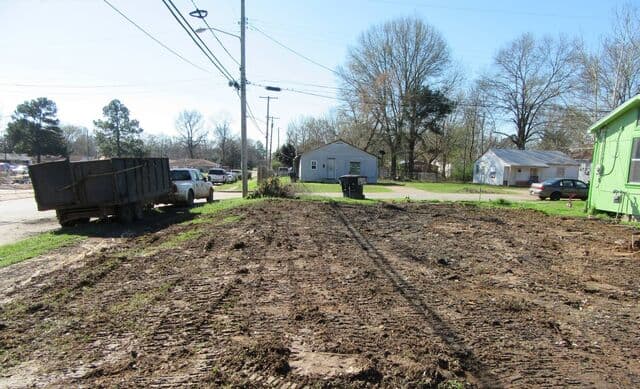 The same residential lot cleared and graded after the debris was hauled away
